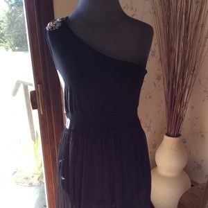 Black off the shoulder cocktail dress.